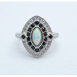 A navette shaped cluster ring set with black and white stones and a synthetic opal, marked 925, size