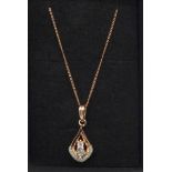 A silver gilt, diamond set pendant on chain