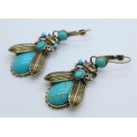 A pair of turquoise set earrings