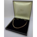 A Swarovski crystal necklace in an associated box