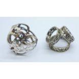 Two silver scarf rings