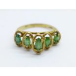 A 9ct gold, five green stone ring, 1.8g, I