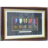 A framed WWII medal group to R A Wheeler, Royal Navy, the Africa Star with North Africa 1942-43 bar,