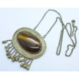 A large tiger's eye pendant, 73mm wide