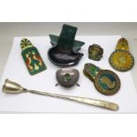 Three enamelled paper clips, cast iron doorstop, Danish candlestick, ball and candlesnuff