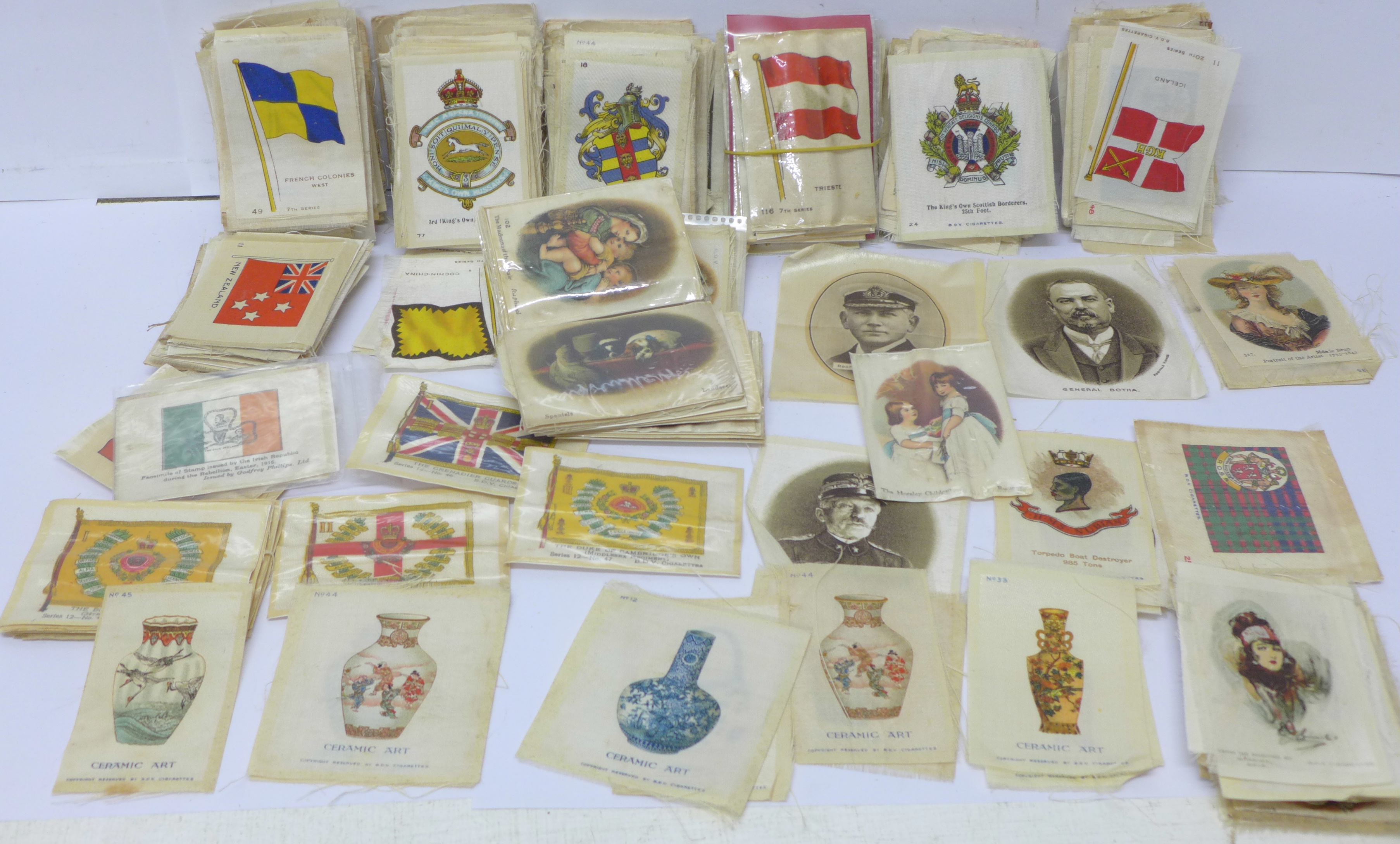 A collection of over 500 cigarette cards and cigarette silks