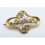 An Edwardian 9ct gold Art Nouveau pearl, peridot and red stone brooch, Birmingham 1909, 2.4g