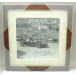A framed signed photograph of Jack Brabham