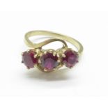 A 9ct gold and three red stone ring, 3.8g, P