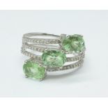 An 18ct white gold, green tourmaline and sixty-two diamond stacking style ring, 6.2g, S