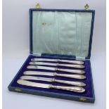 A cased set of six silver handled knives