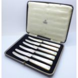 A set of six mother of pearl and silver knives, Asprey of London, Sheffield 1931, boxed