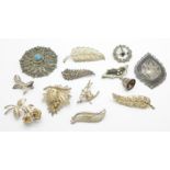 Silver brooches including a New Zealand fern brooch