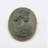 A yellow metal set lava cameo brooch, (tests as 9ct gold)