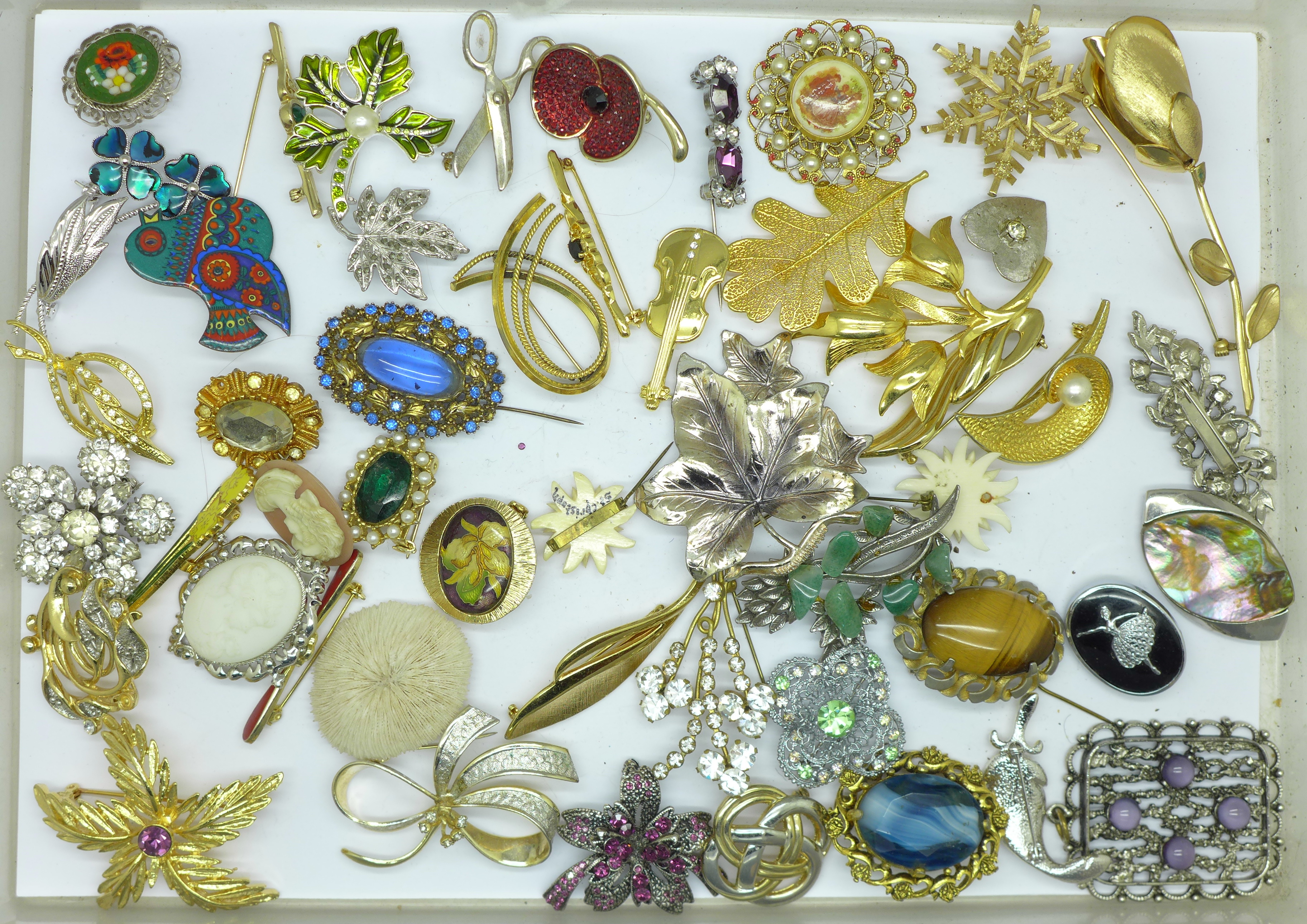 Forty-nine brooches and a pendant