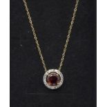 A silver gilt, garnet and white topaz pendant and chain