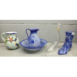 A Staffordshire china wash jug and bowl, a blue china shoe, a glass shoe decanter and a water