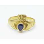 A yellow metal and blue stone set claddah ring, (tests as high carat gold), 4.6g, Q