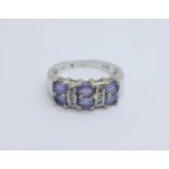 A 9ct white gold, diamond and purple stone ring, 3.5g, M