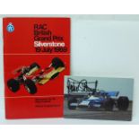 A 1969 British GP programme with signed photograph of Jackie Stewart driving the winning car
