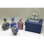 A collection of five perfume bottles, boxed