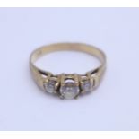 A 9ct gold, three stone ring, 1.6g, L