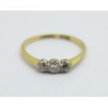 An 18ct gold and three stone diamond ring, 1.5g, K