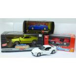 Four die-cast model vehicles; Ertl American Muscle 1970 Boss Mustang, Revell Metal Shelby 427 Cobra,