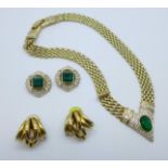 A designer jewellery set with necklace and a pair of matching earrings and one other pair of