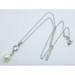 An 18ct white gold and pearl pendant on a sterling silver chain