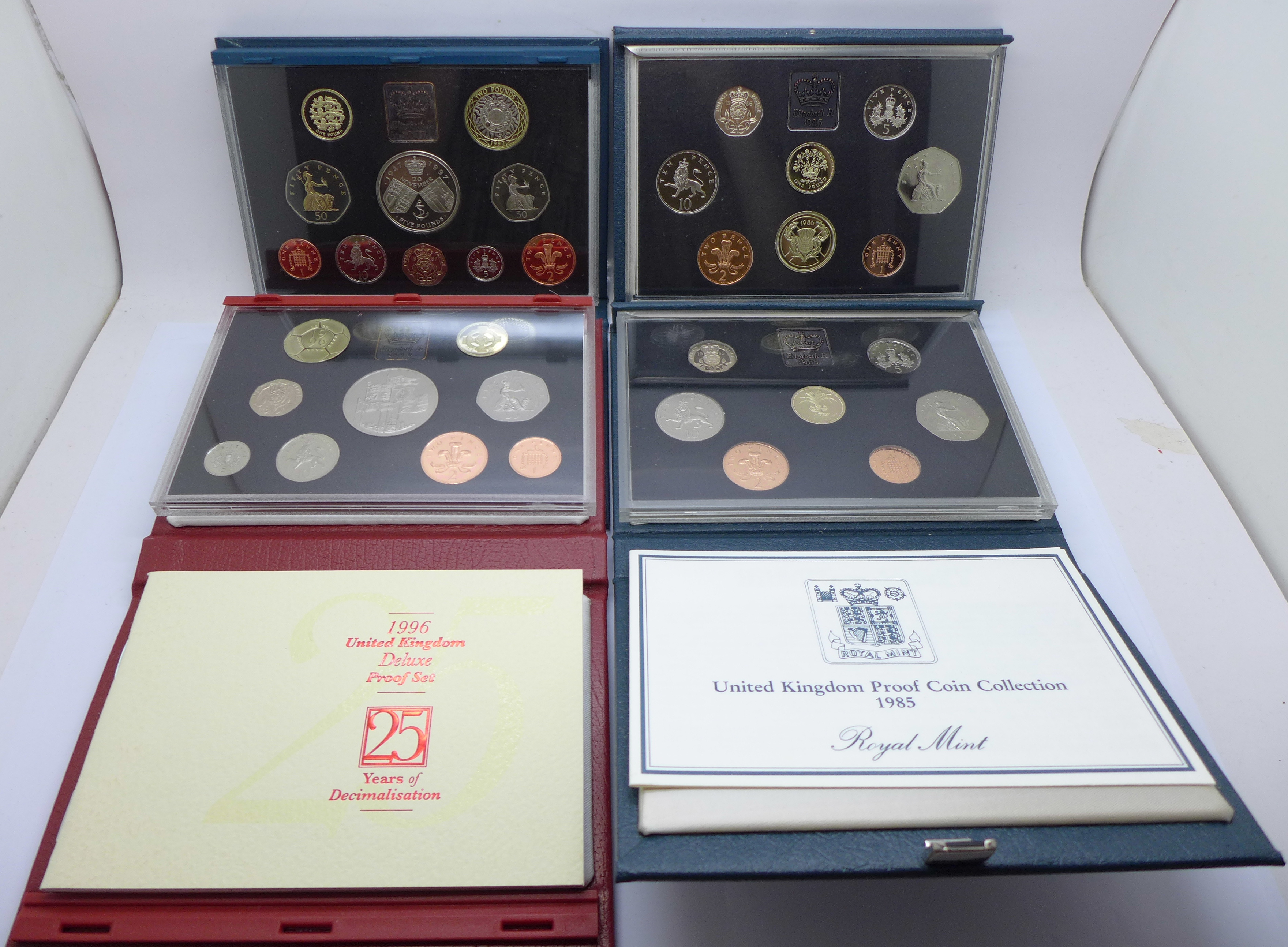 Four Royal Mint proof coin sets, 1985, 1986, 1996 Deluxe 25 years of Decimalisation and 1997