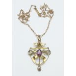 A 9ct gold, amethyst and pearl pendant, (one pearl missing), on a yellow metal chain, (tests as
