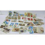 A collection of cigarette cards, various makers