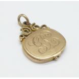A 9ct gold locket, Birmingham 1938, J.T.J., 4.1g, with initials