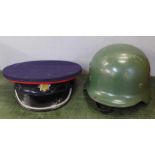 A bandsman's peaked cap and a Spanish Army helmet, a/f