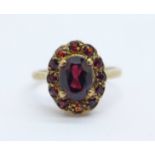 A 9ct gold and garnet cluster ring, 2.9g, K