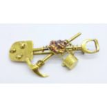 A yellow metal miner's brooch, 6.4g, 52mm