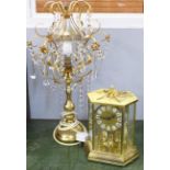 A Kundo clock and a table lamp with crystal drops