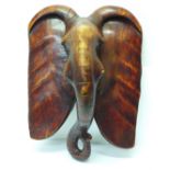 A Kenyan carved elephant wall plaque, height 37cm