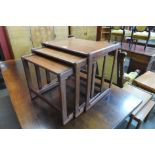 A teak nest of tables and a teak nest of two tables