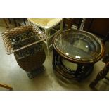 A bamboo and glass topped nest of tables and a wicker waste paper bin