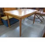 A Danish teak extending dining table