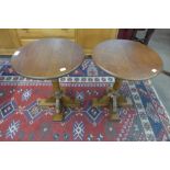 A pair of oak circular lamp tables