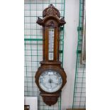 A Victorian carved oak aneroid barometer, glass cracked