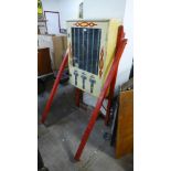 A 1950's painted wooden toy vending machine, with quantity of toy boxes, (no key)