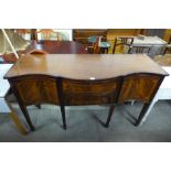 An inlaid mahogany serpentine sideboard