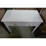 A Victorian painted pine two drawer side table