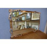A peach and copper effect framed mirror