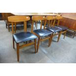 A set of four teak dining chairs