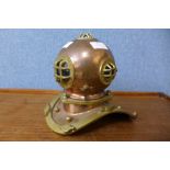 A miniature copper and brass diver's helmet